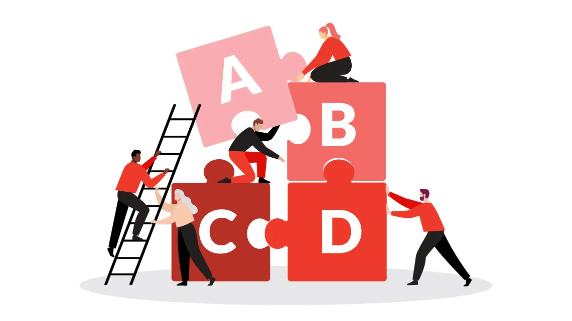 men and women building puzzle pieces with the letters ABCD on each 