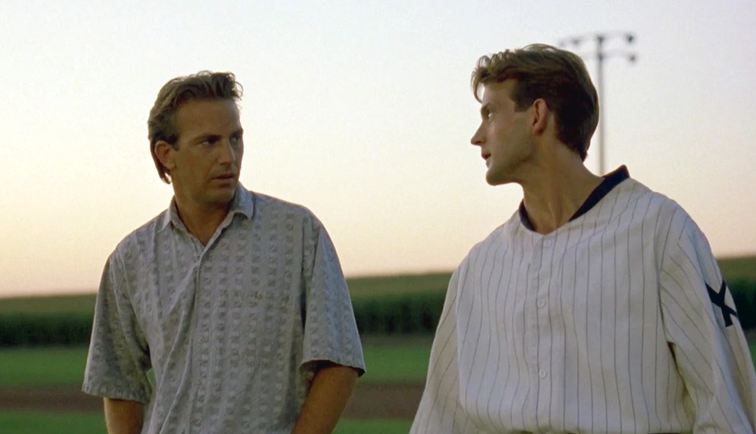 Dwier Brown and Kevin Costner in Field of Dreams Dwier Brown and Kevin Costner looking at each other in a scene from the film Field of Dreams
