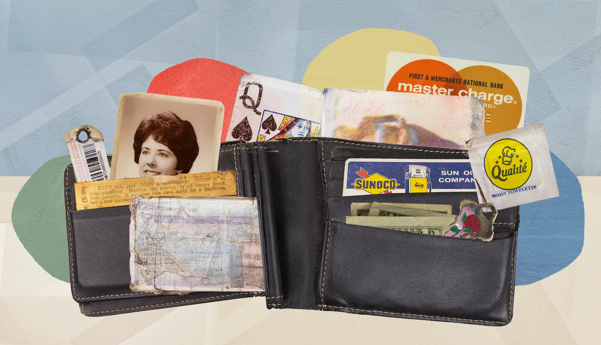 a photo shows an old school leather wallet. The wallet is opened, with a photo, drivers license, loyalty card, credit card and a moist towelette tucked inside