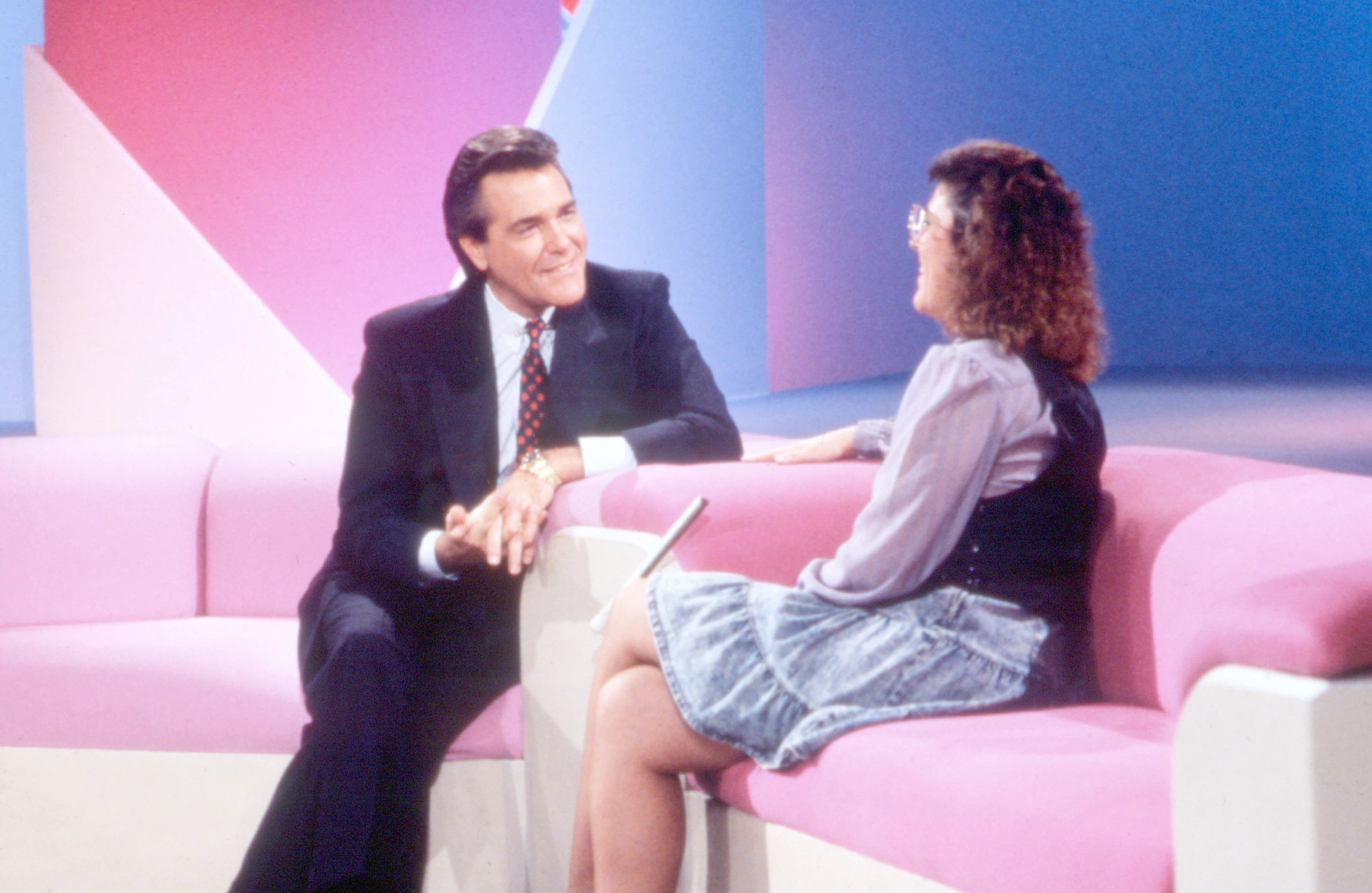 Chuck Woolery and a contestant 
