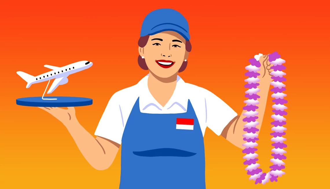 a worker holds a small model plane in one hand, and a flower lei in the other