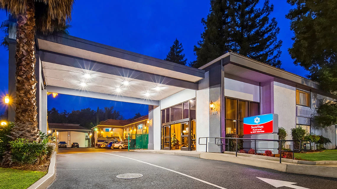SureStay Plus® Hotel by Best Western Hotel drive through at night