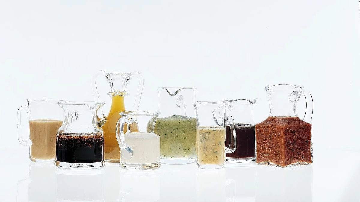 A close-up view of citrus-cumin splash in pitchers