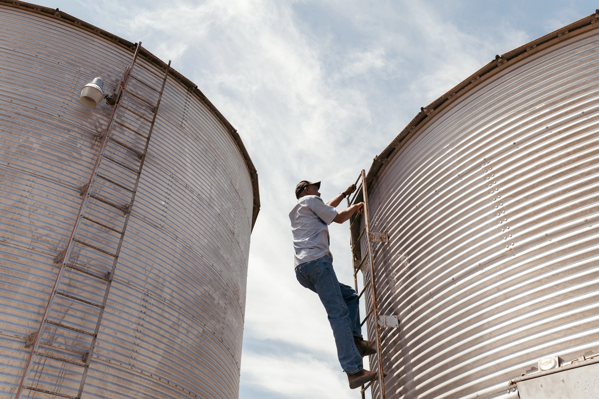 a person climbing a grain silo