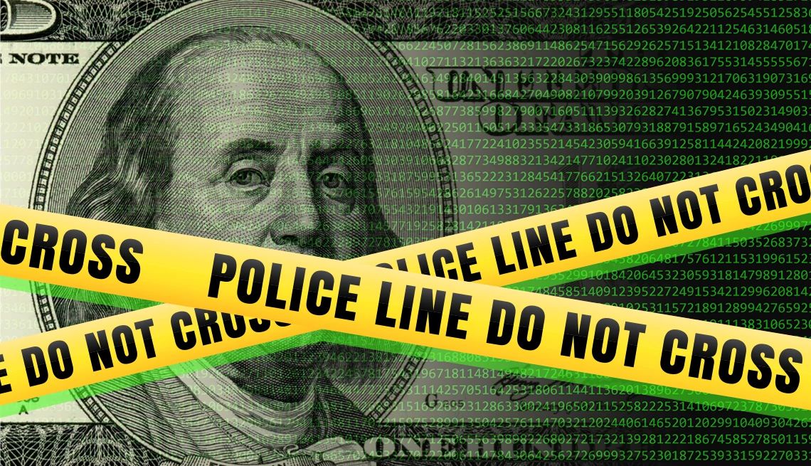 A federal bill would give law enforcement more resources to investigate financial crimes a one hundred dollar bill with yellow police tape