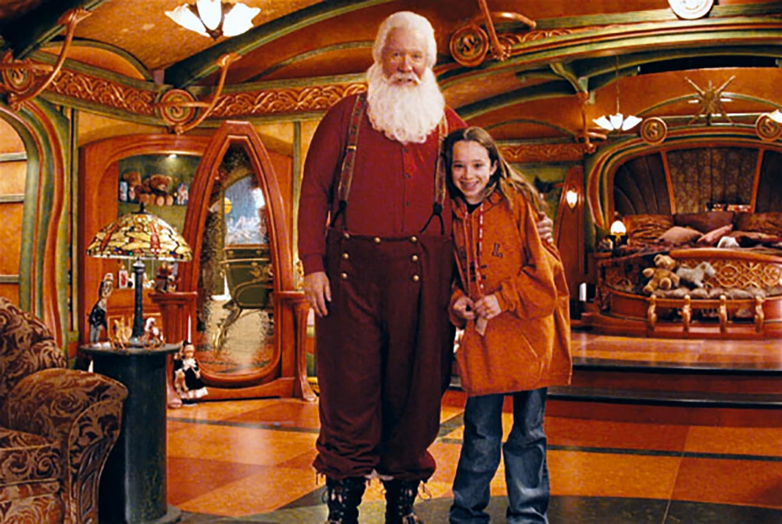 A photo shows Tim and daughter Katherine on the set of The Santa Clauses 2