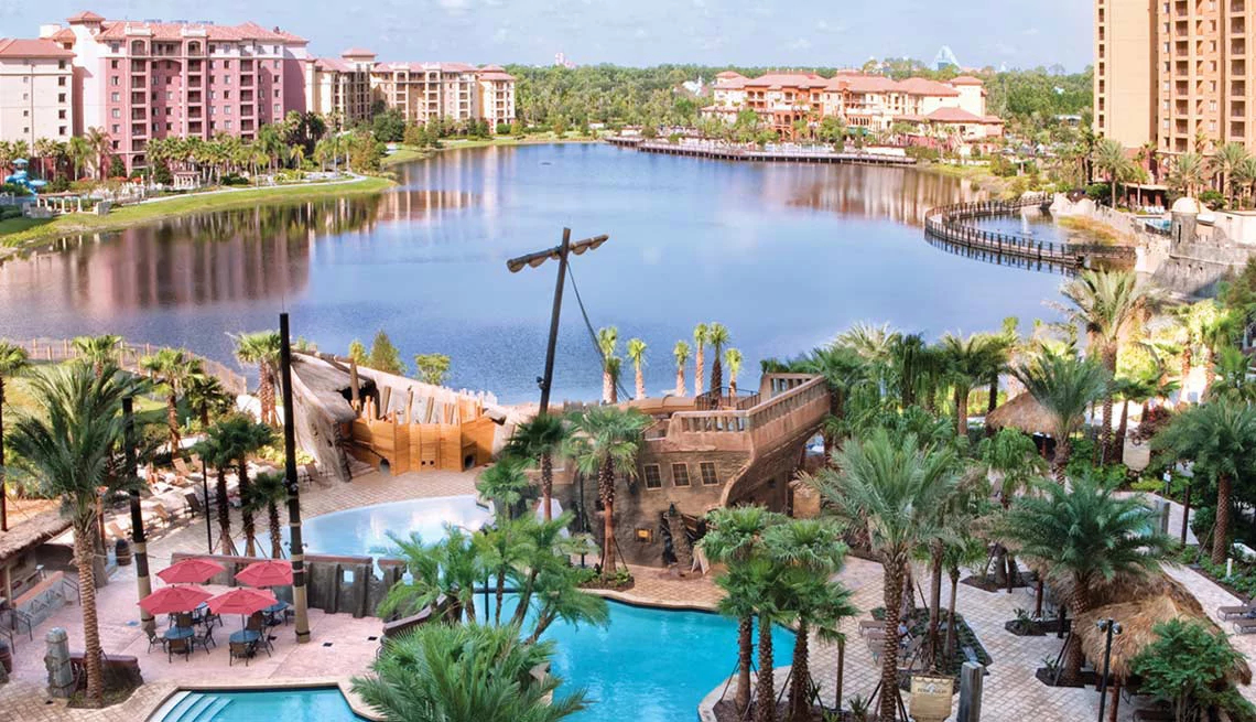 hotel with ship wreck in pool with creek in background