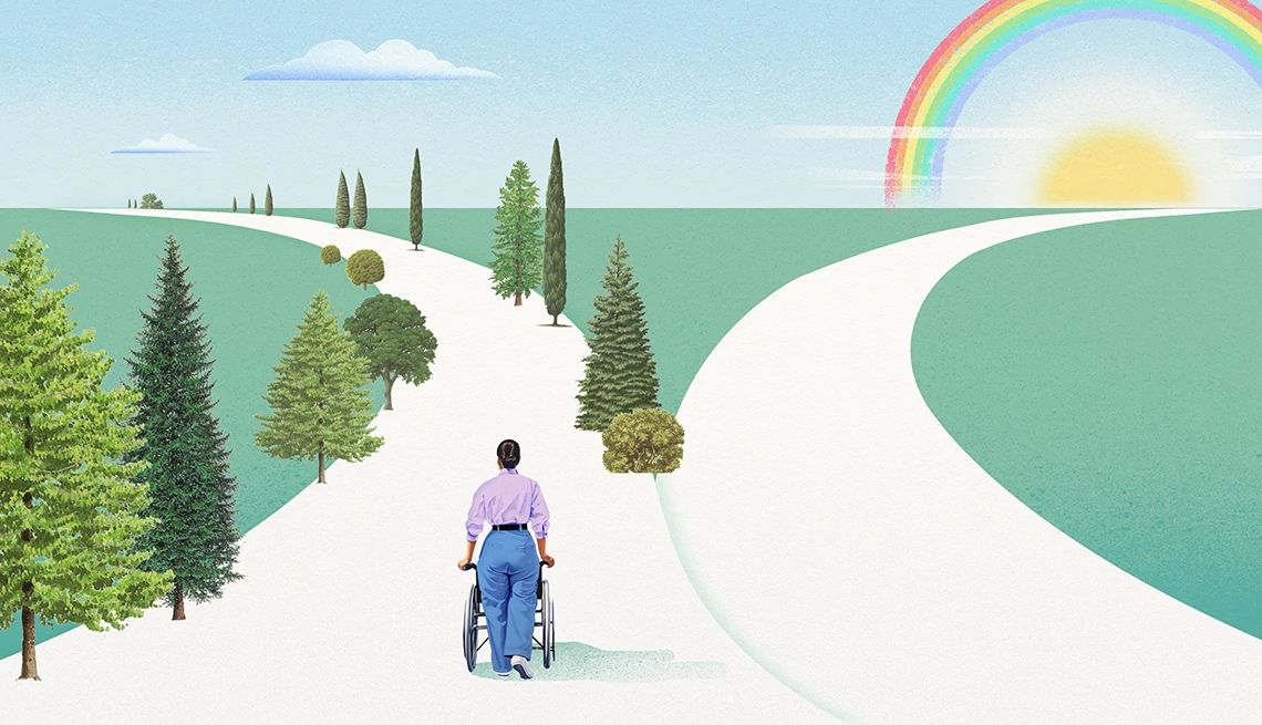 a caregiver pushes a wheelchair down a road that splits into two pathways: one lined with trees, the other with a rainbow at the end