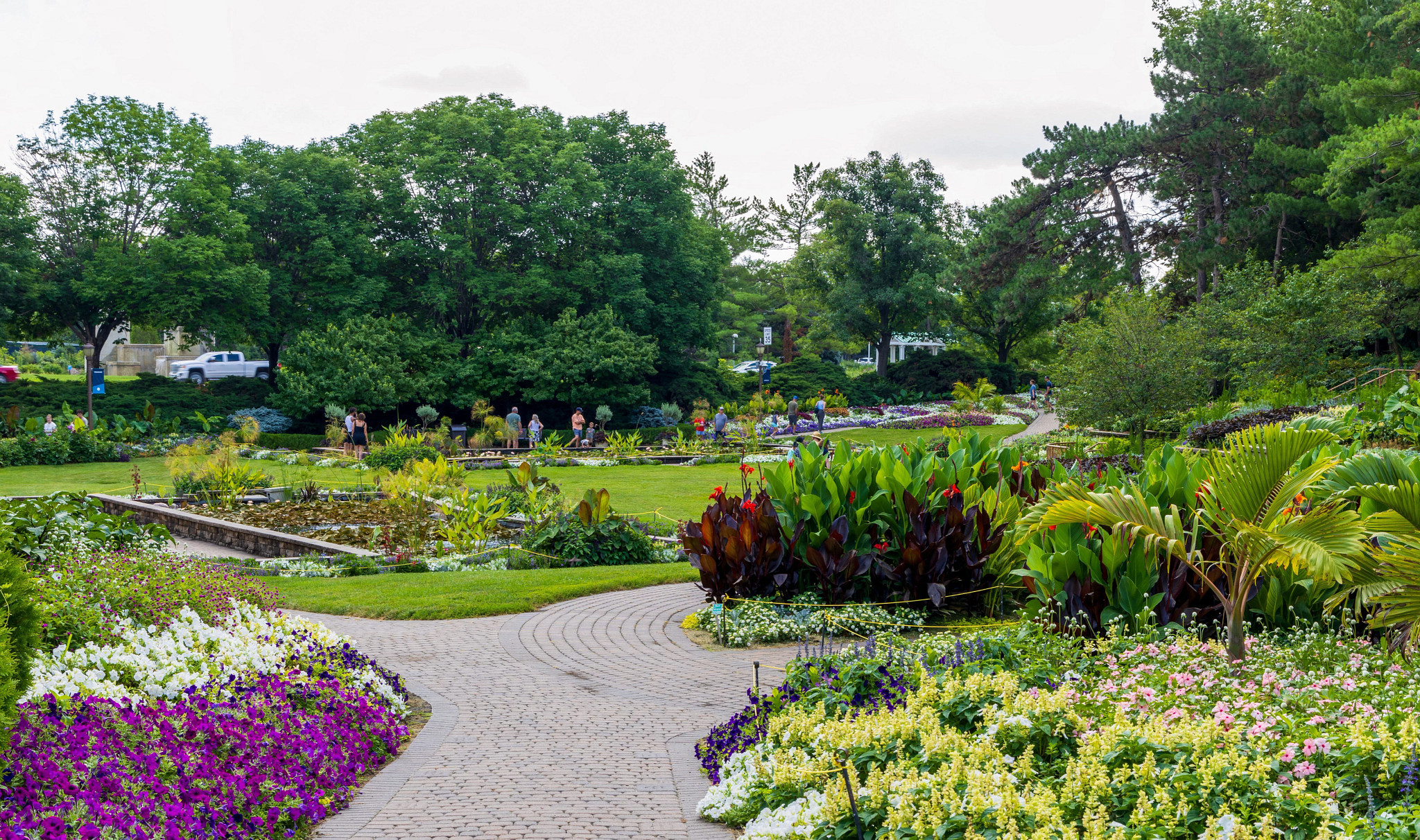 people walking around gardens