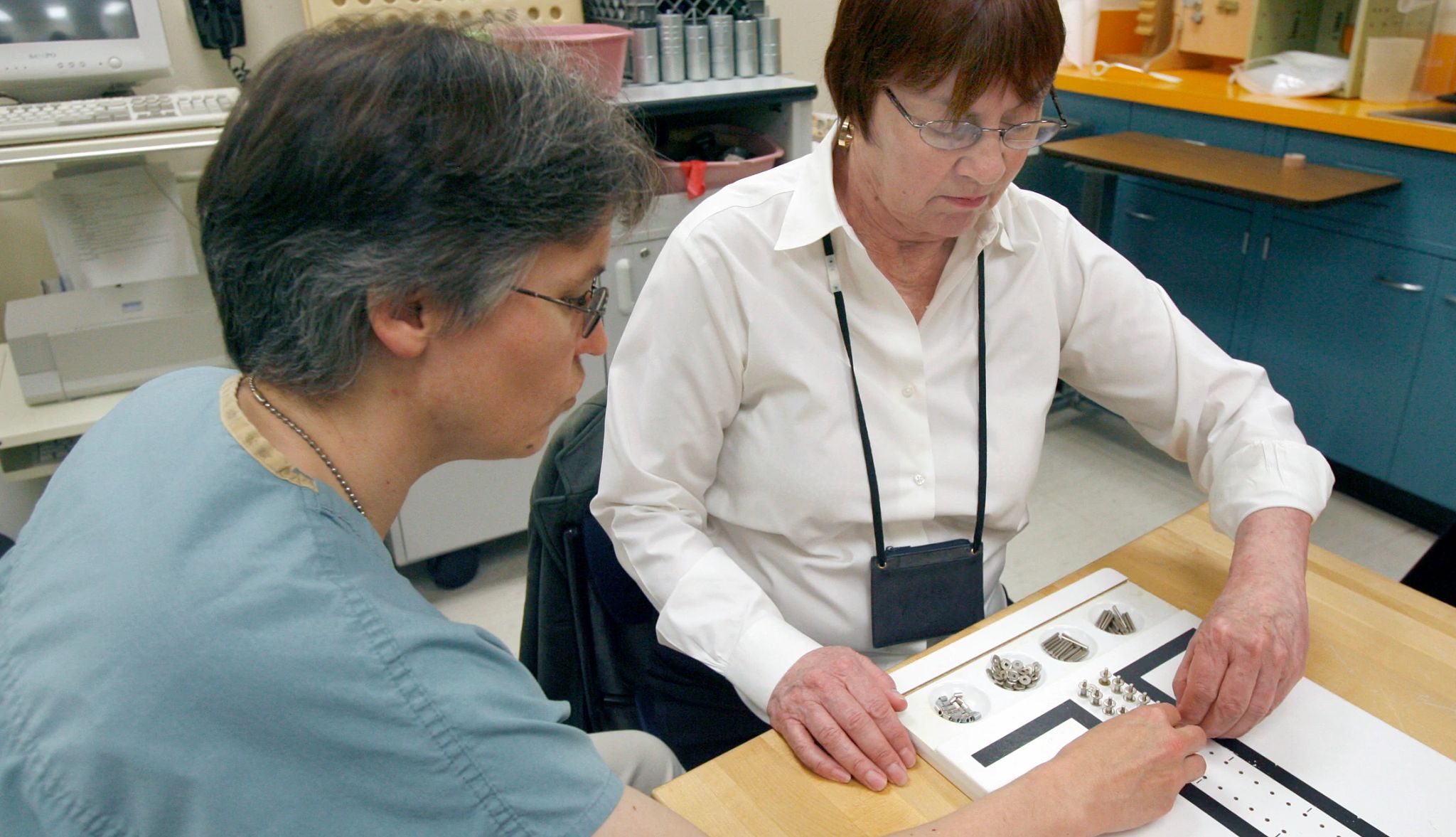 What is occupational therapy an occupational therapist works with a patient on hand exercises