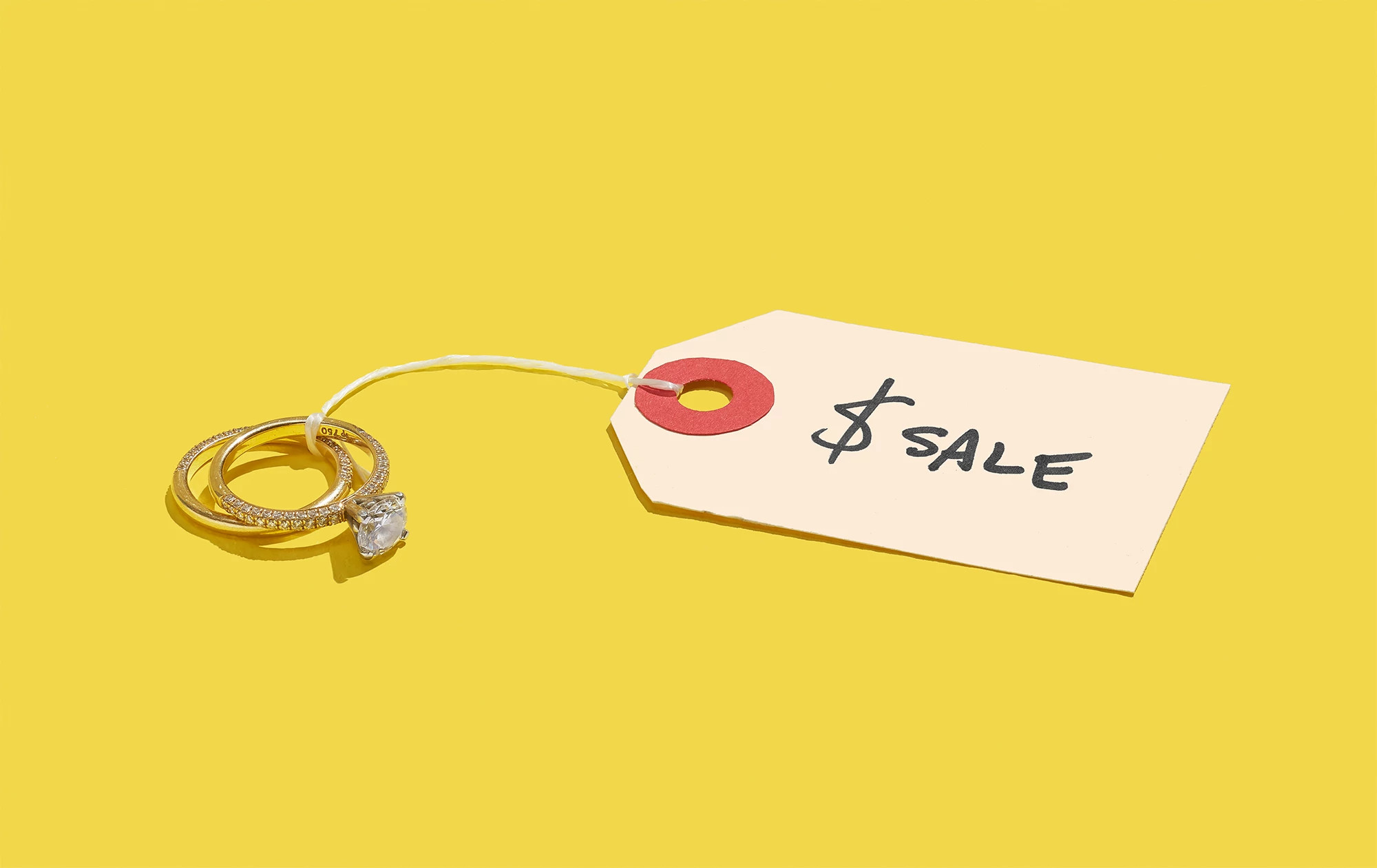 wedding bands with a price tag wrapped around them