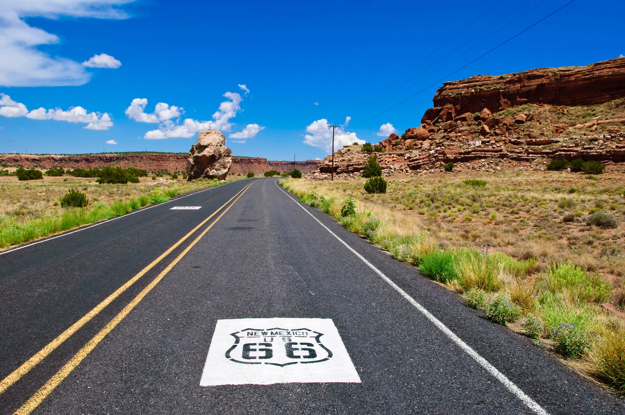 the sign for new mexico's route 66 painted on a road