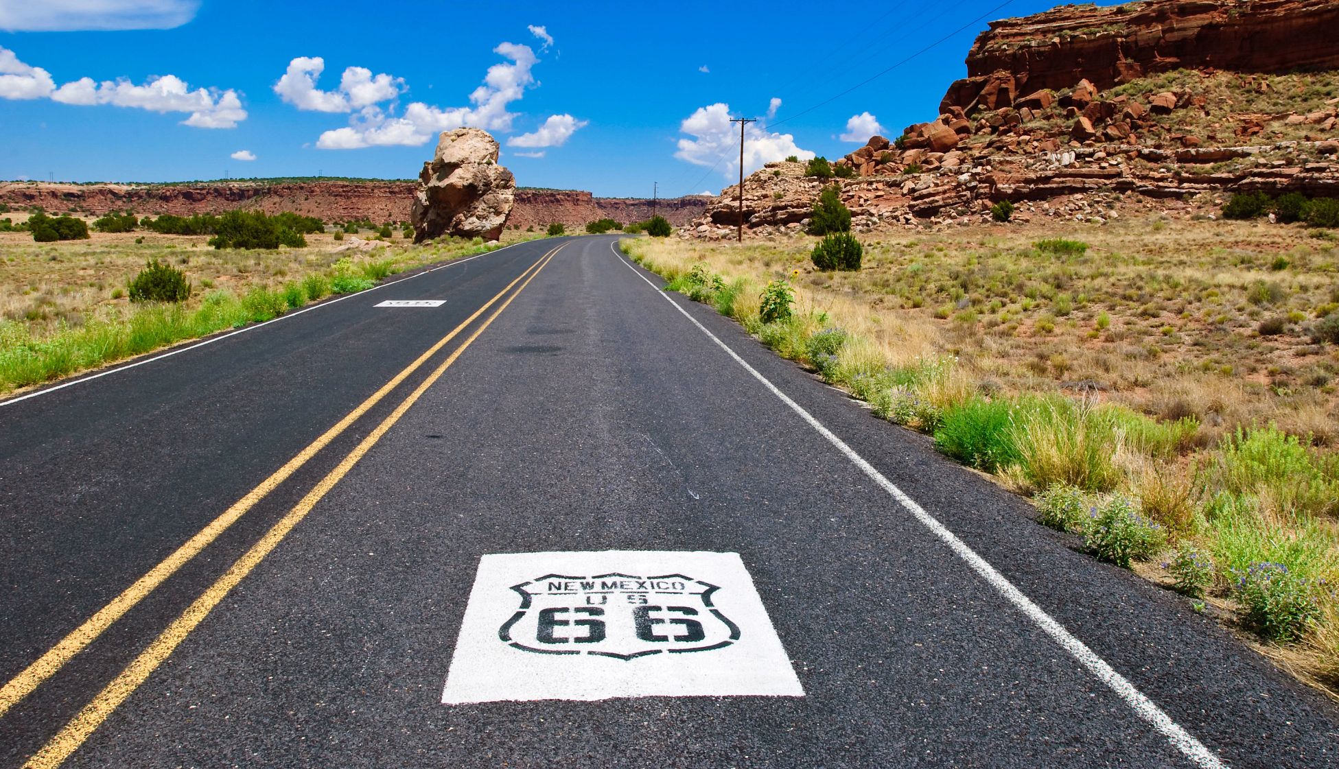 Affordable U.S. Destinations the sign for new mexico's route 66 painted on a road