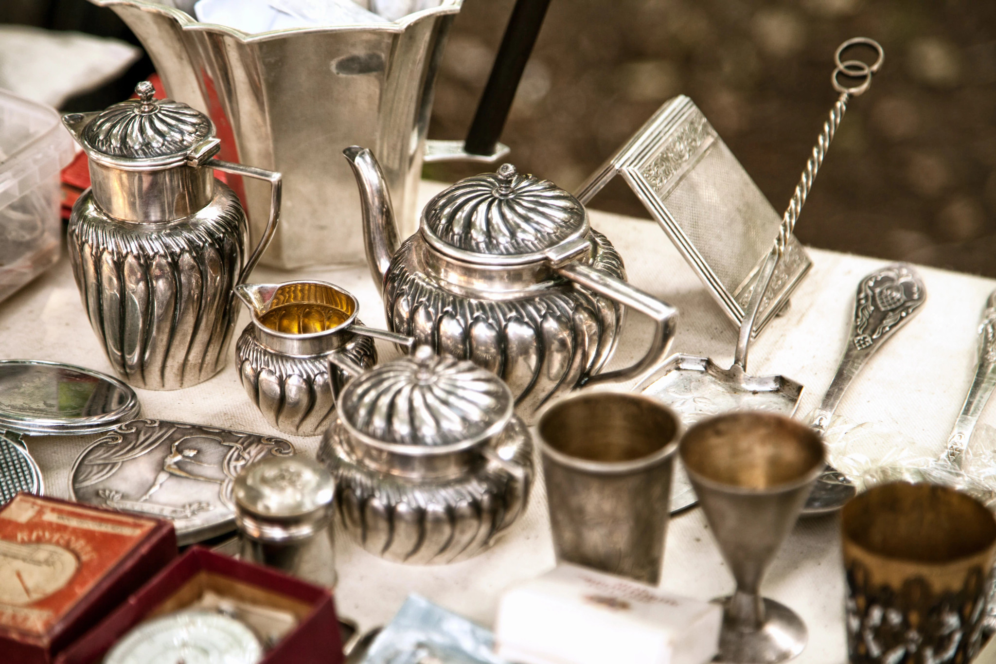 Metal tableware collectibles on table