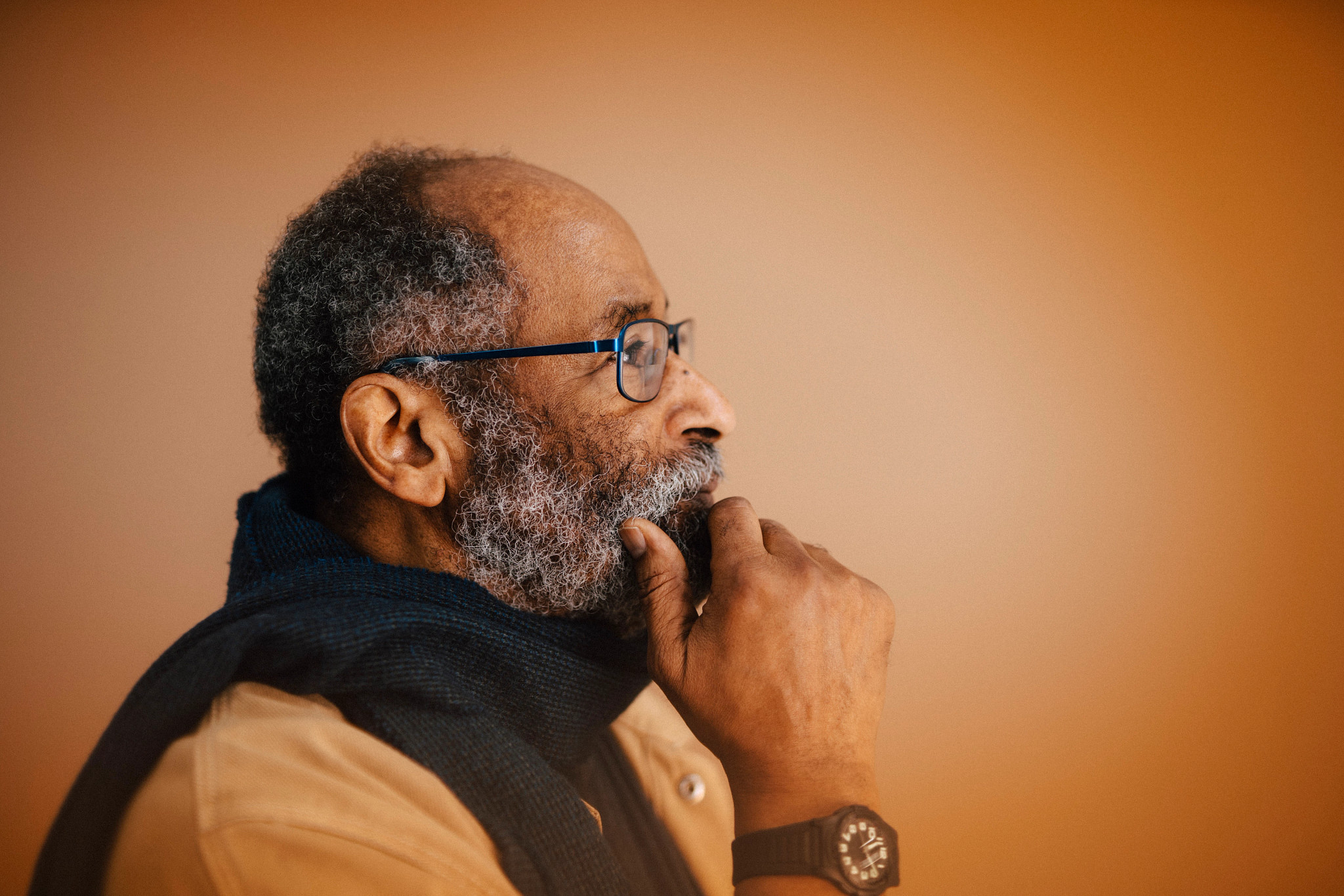a Black man with a contemplative look