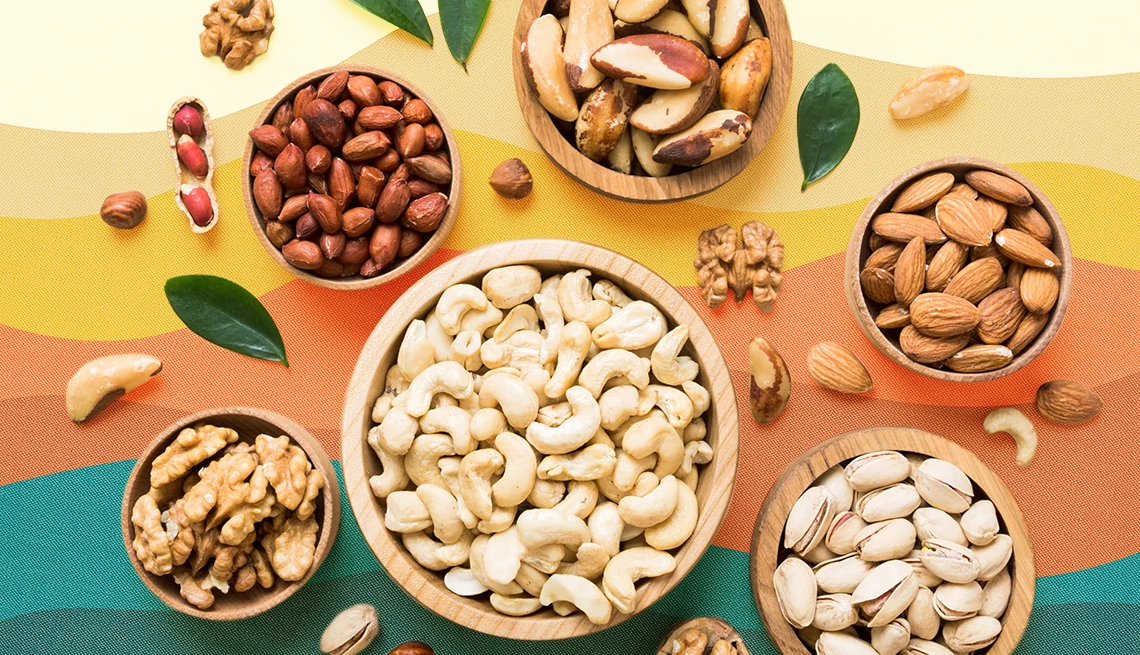 how to add more nuts to your diet assorted nuts on a colorful background