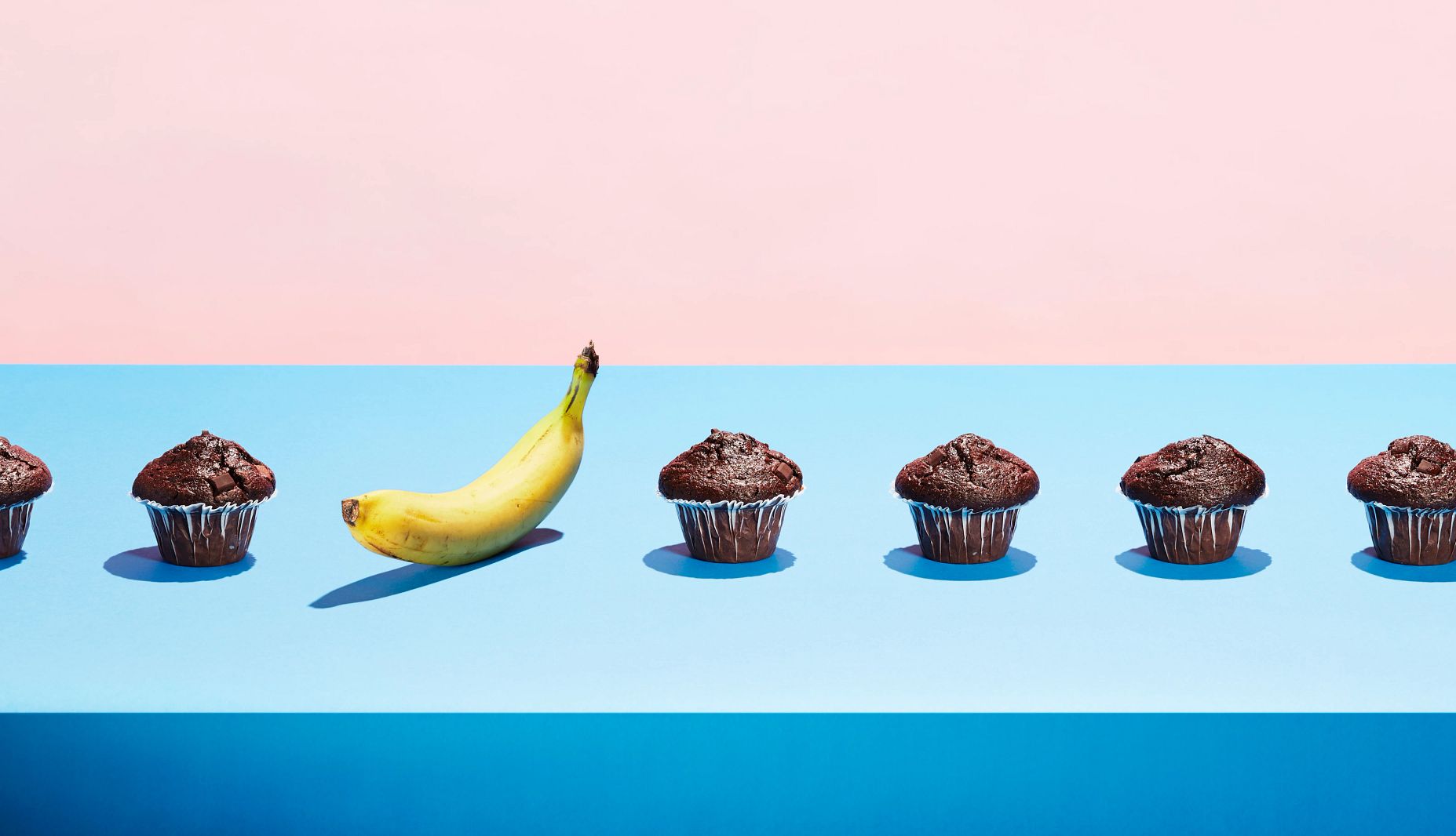 Healthy Living Mistakes conveyer belt with muffins and a banana
