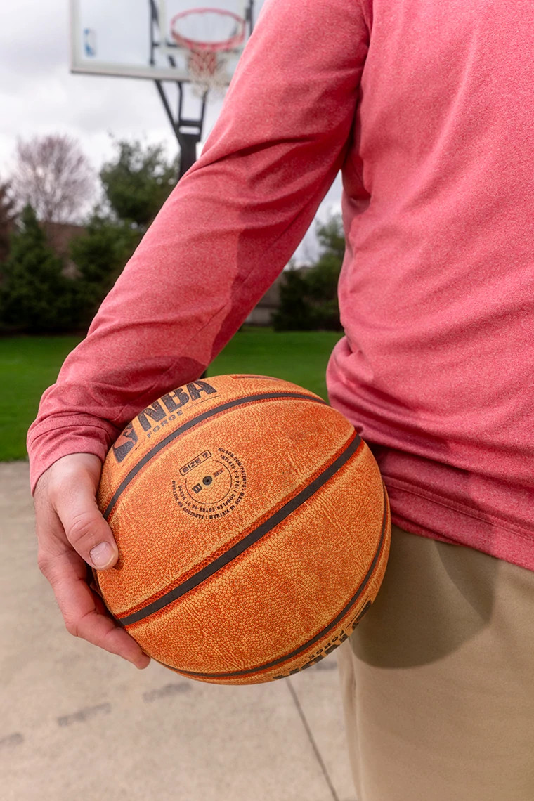man holding basketball