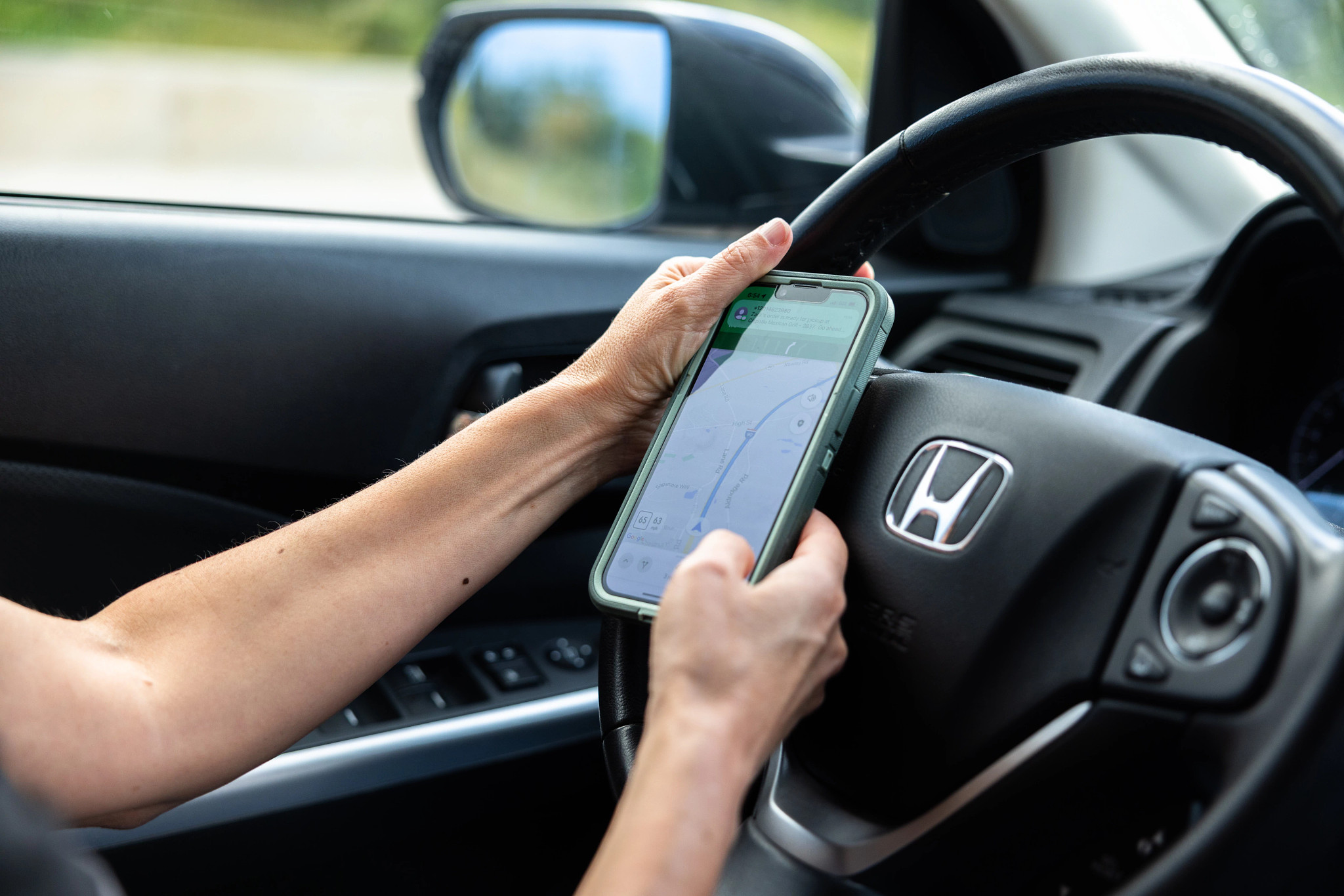 Robin Flanigan using GPS on her phone to locate a person's home