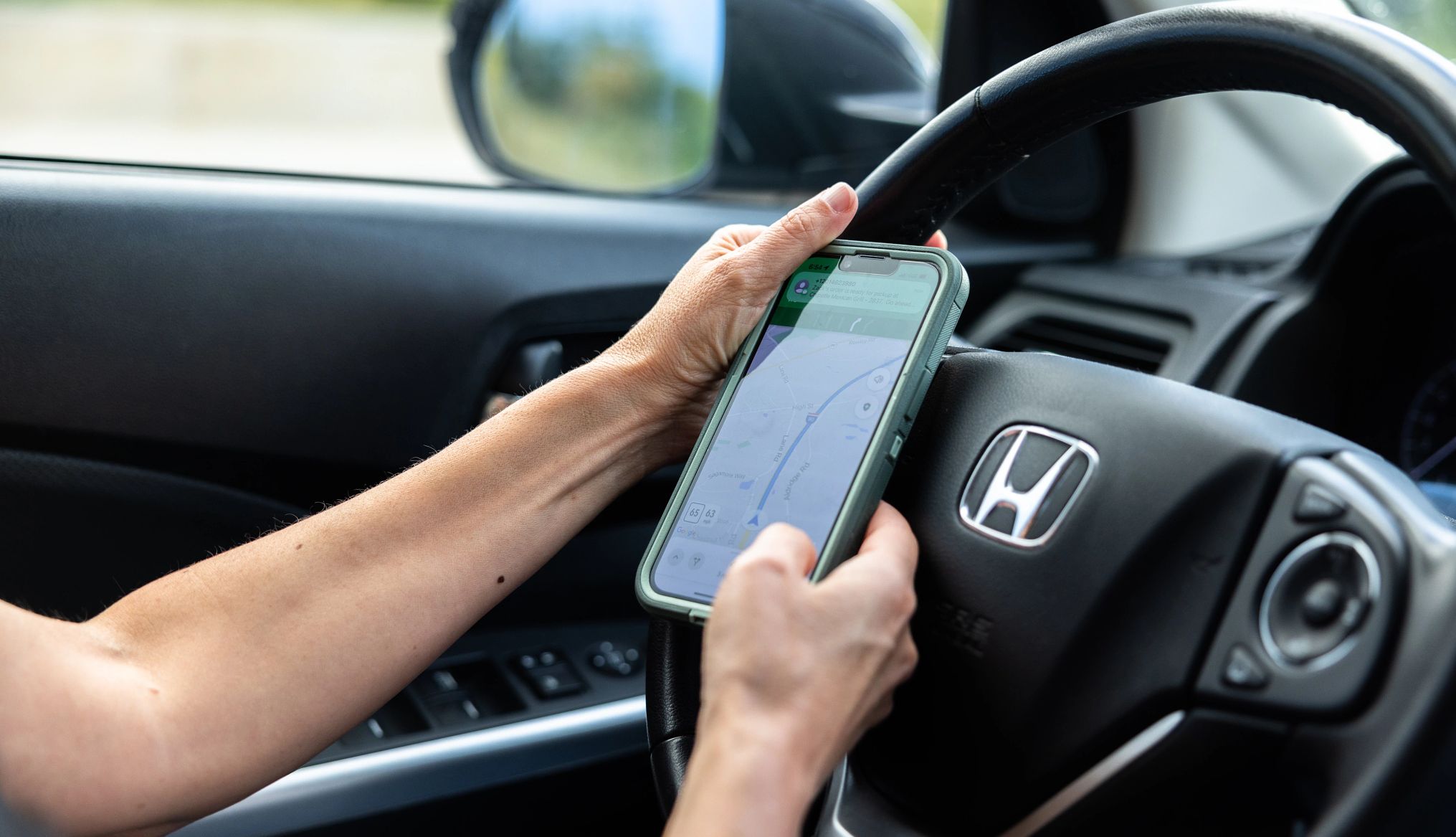 DoorDashing isn't about the money for her Robin Flanigan using GPS on her phone to locate a person's home