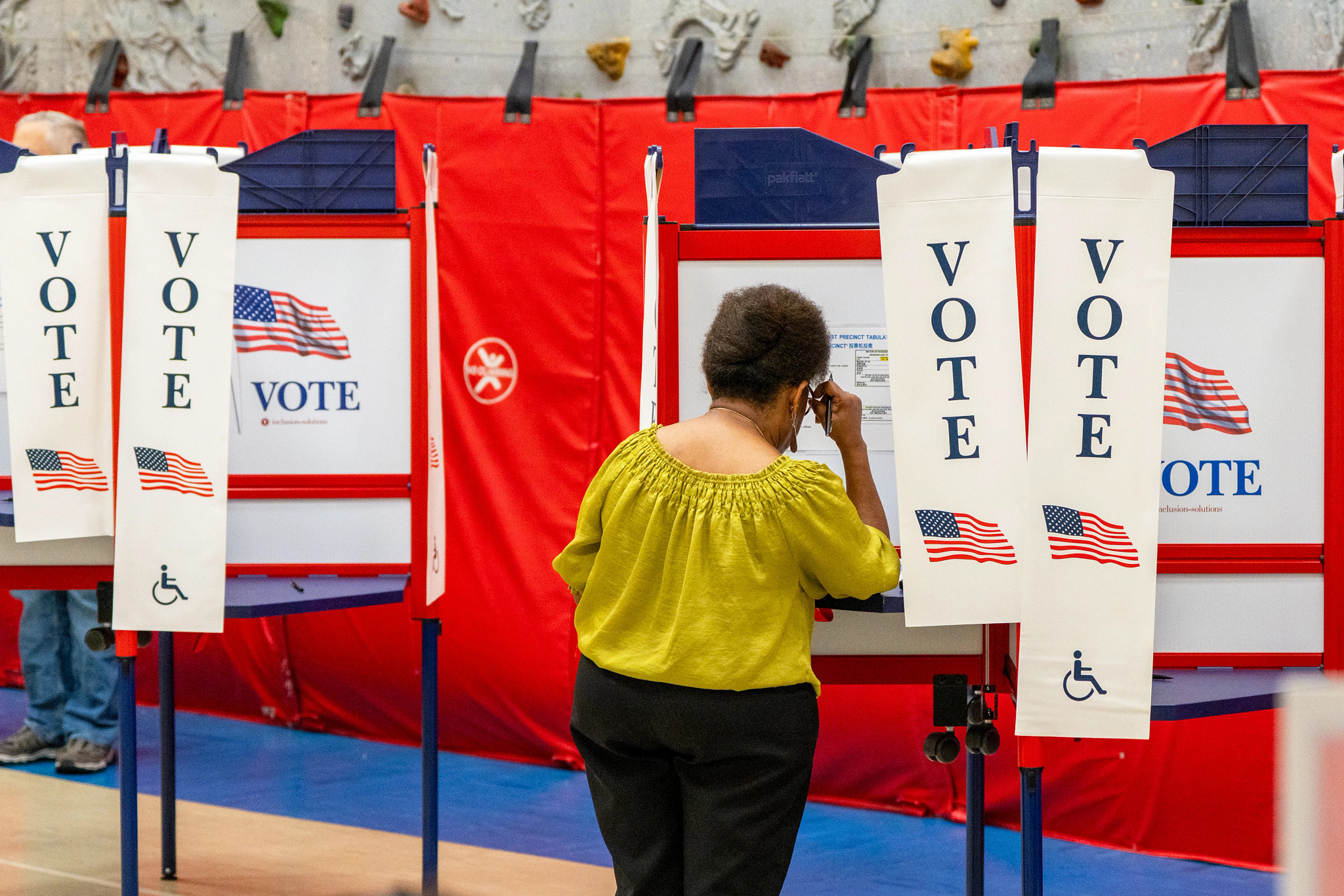 a person is casting their ballot