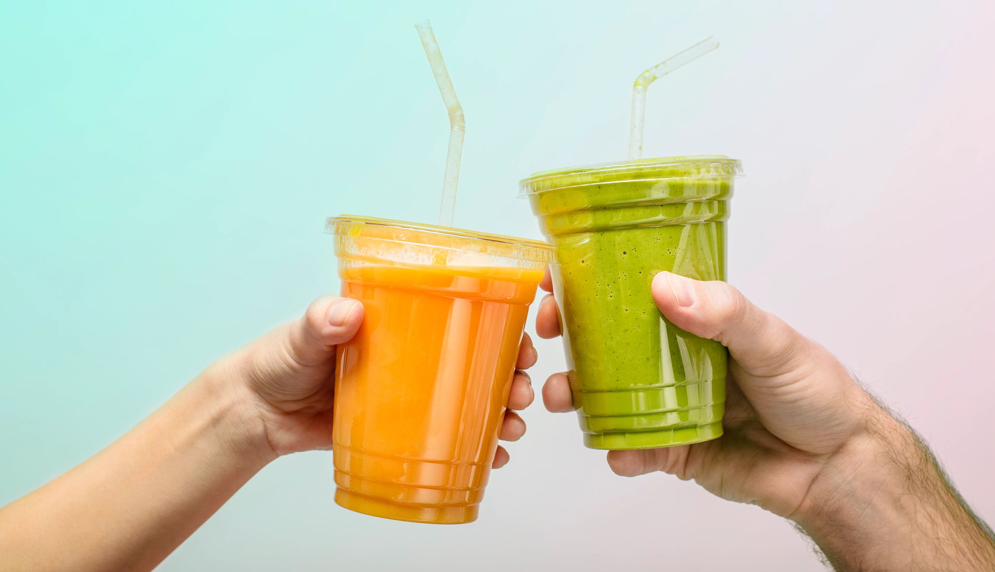 summer solstice deals two hands holding cups of smoothies