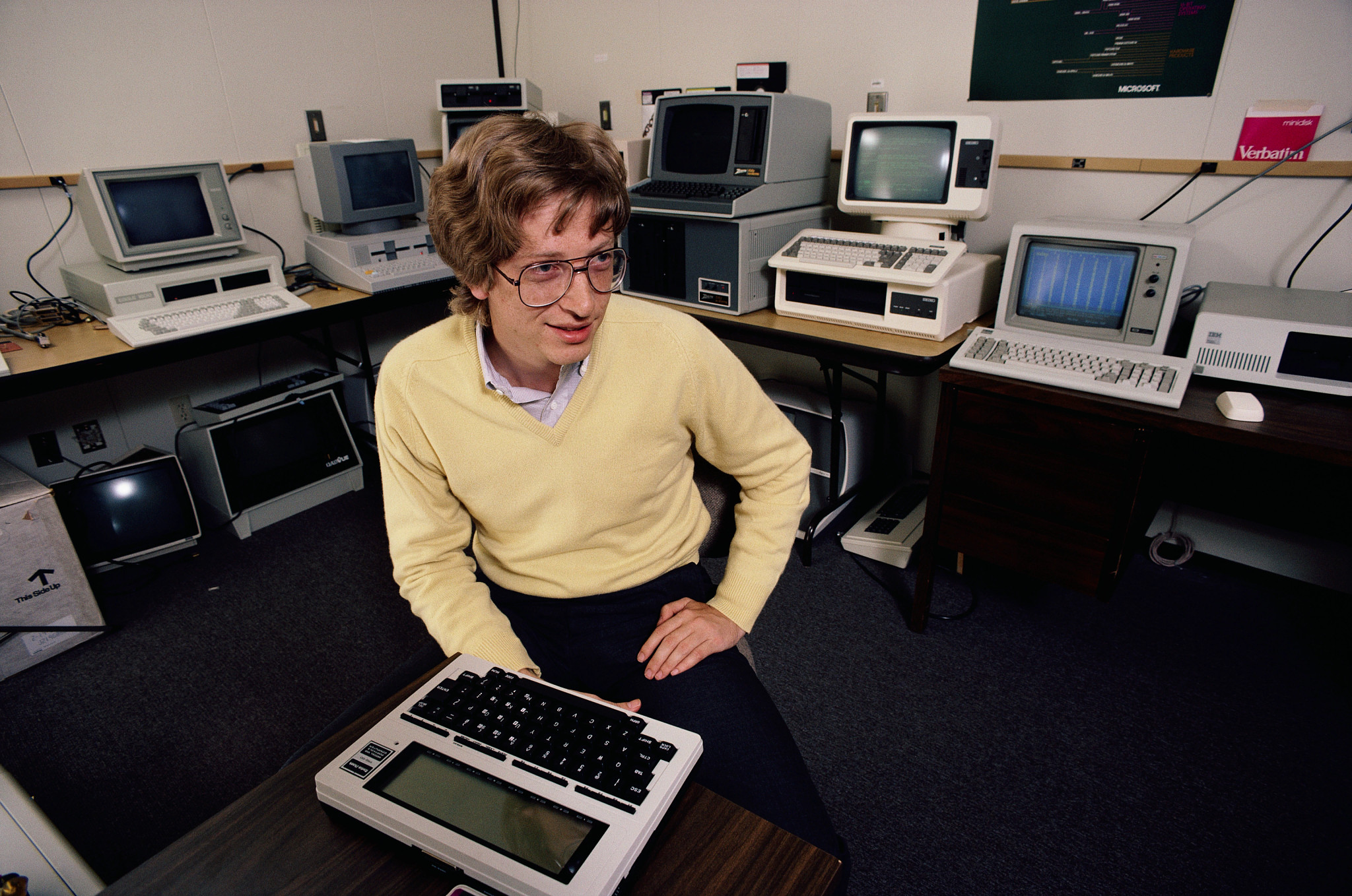 A young Bill Gates, surrounded by the early machines that shaped the digital age 
