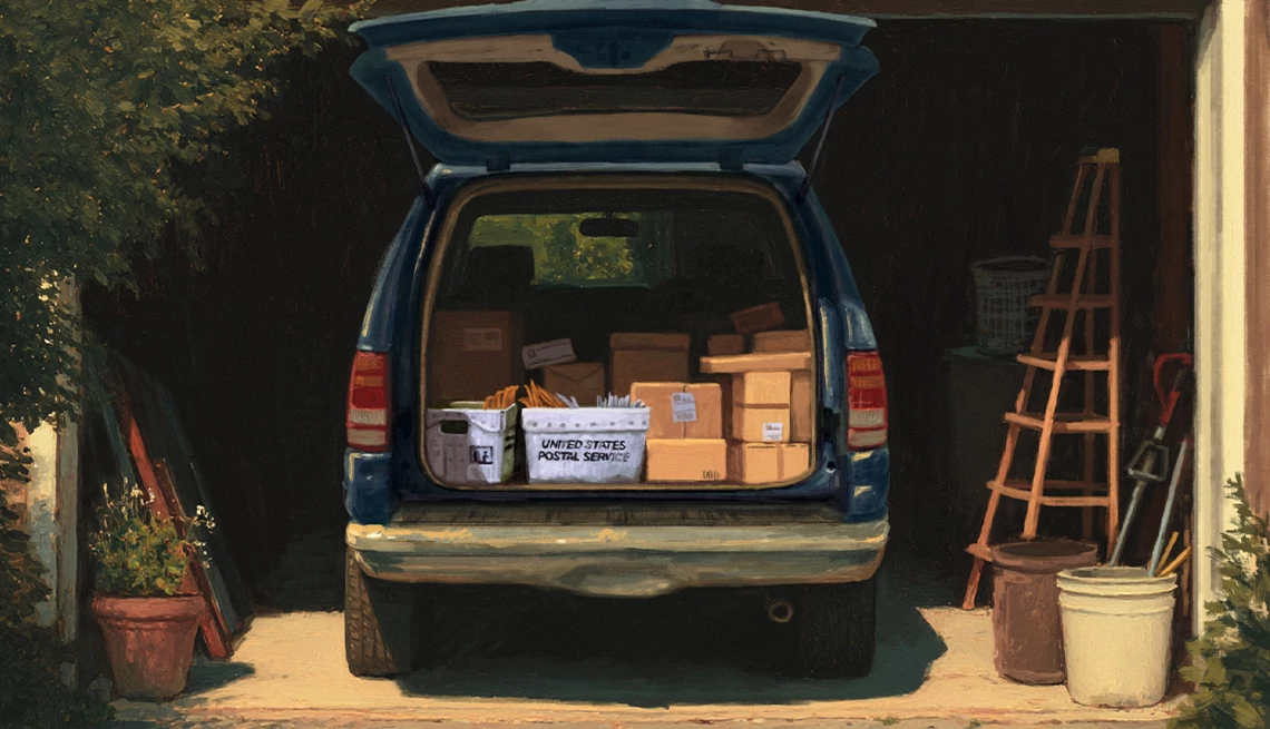 a mail truck parked in a garage with the back open, showing various parcels and bins filled with envelopes