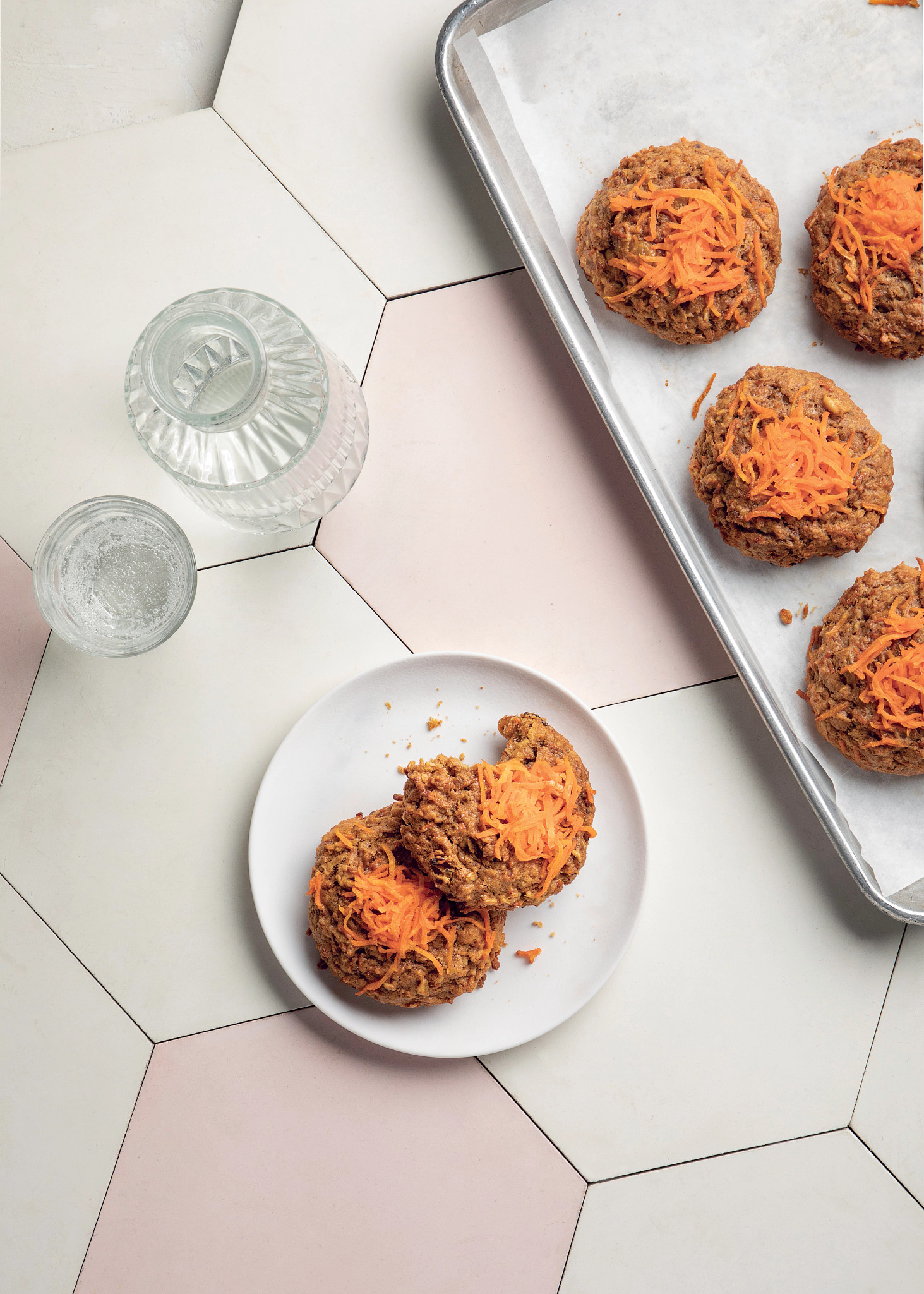 Morning Gloria recipe Part of tray with Morning Gloria cookies on it next to small plate with two of the cookies on it, one has bite out of it
