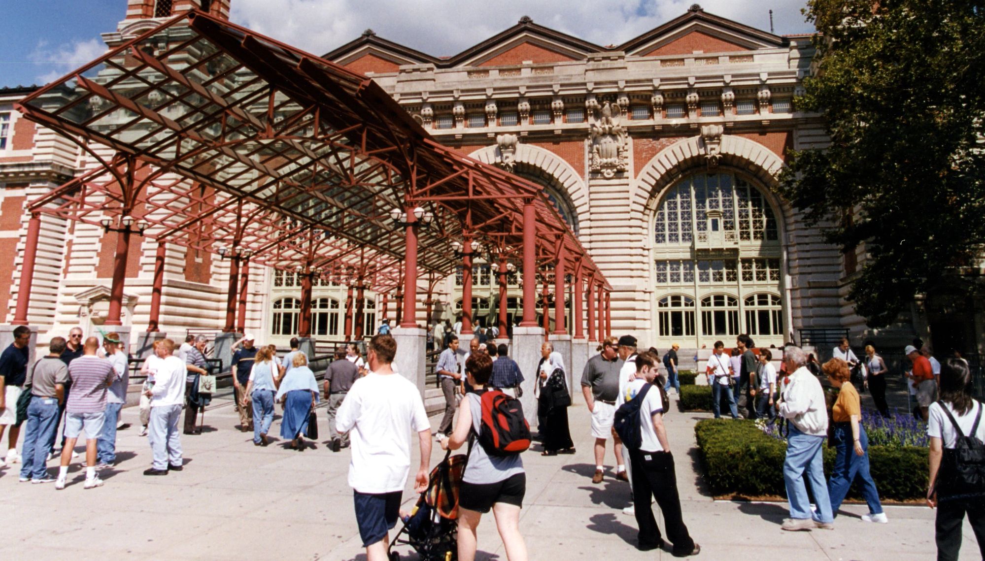people walking around the ellis island national museum of immigration