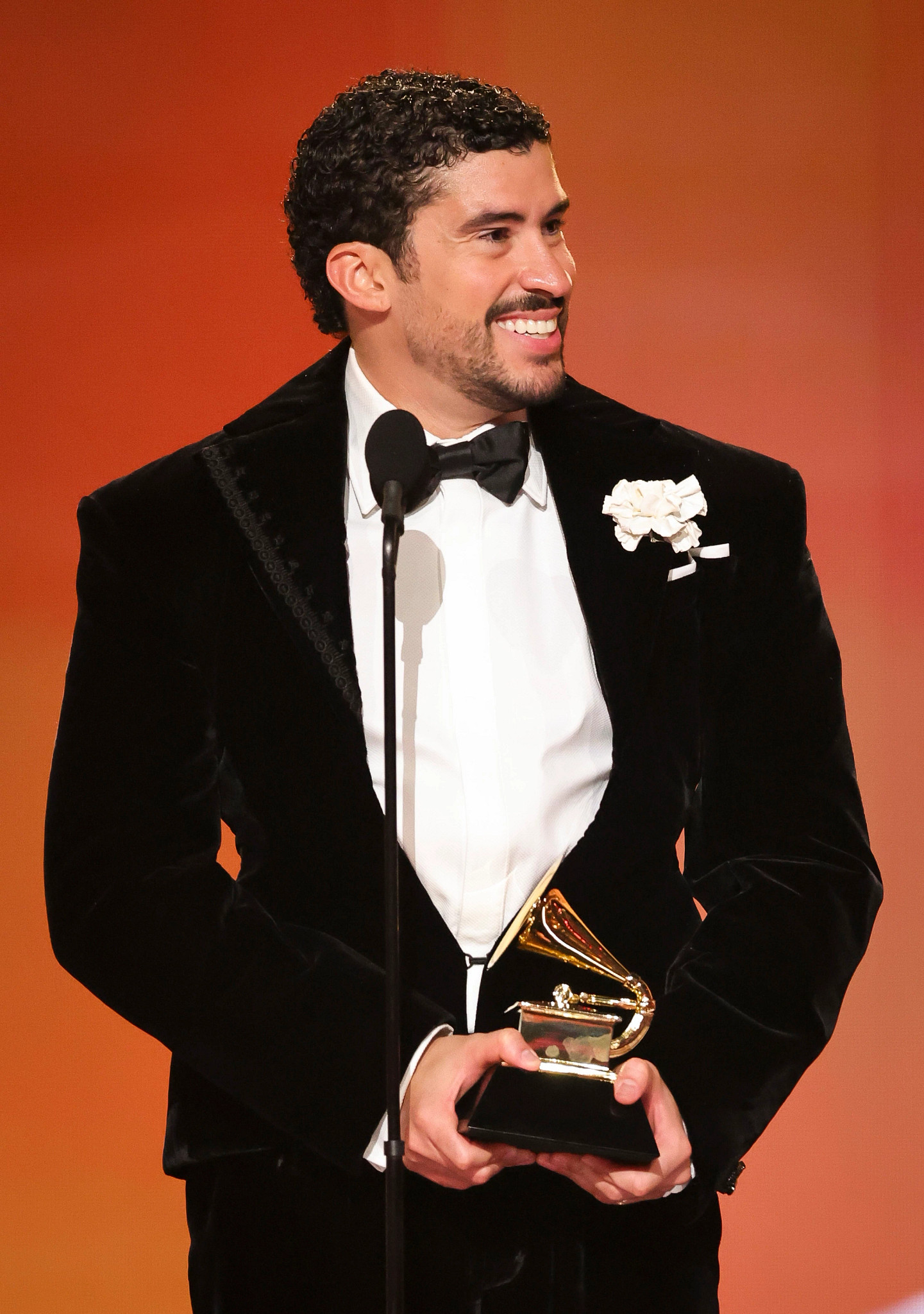 bad bunny holding a grammy award