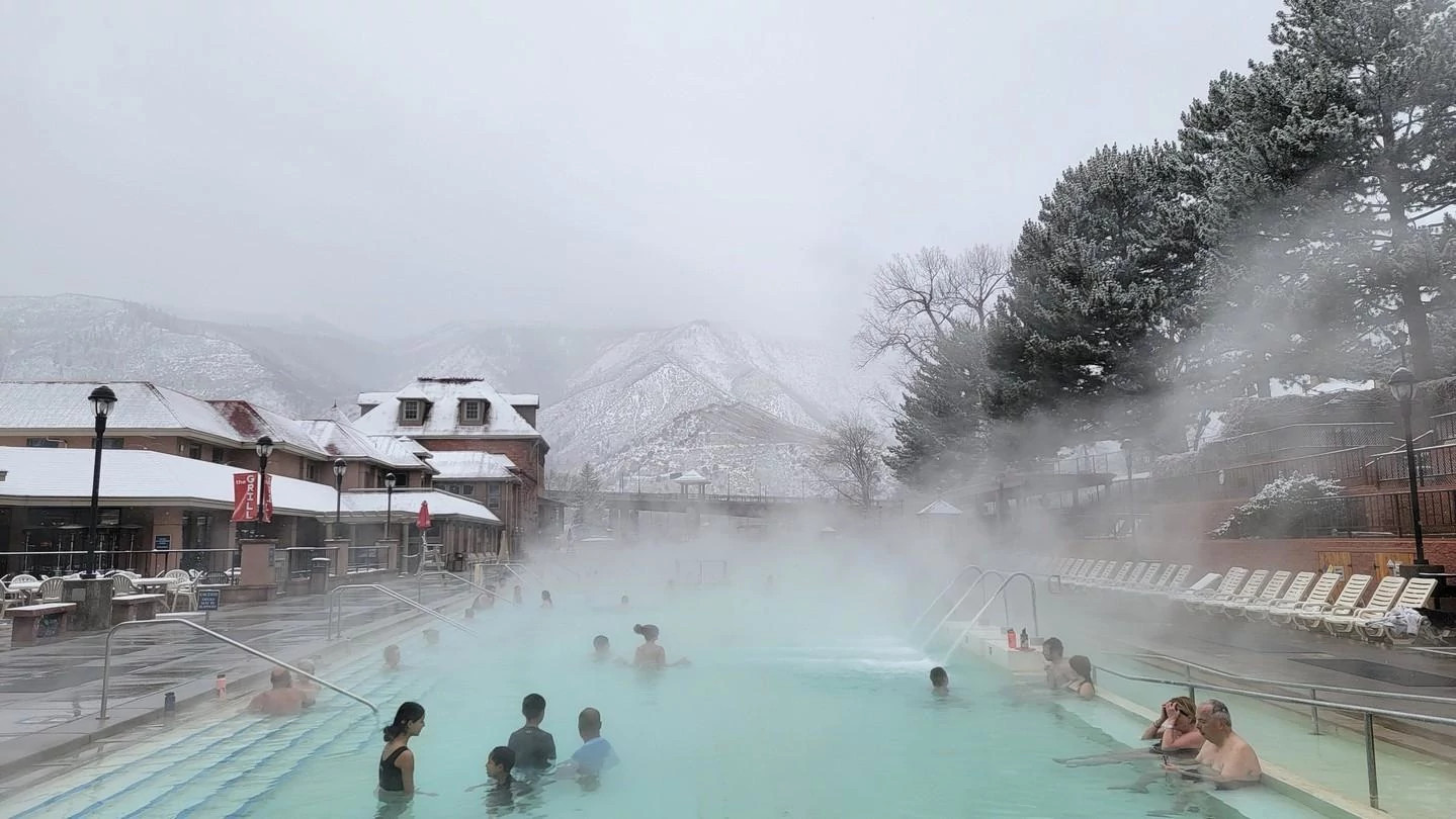 Bathers take a dip in Glenwood Springs pool in an icey-landscape