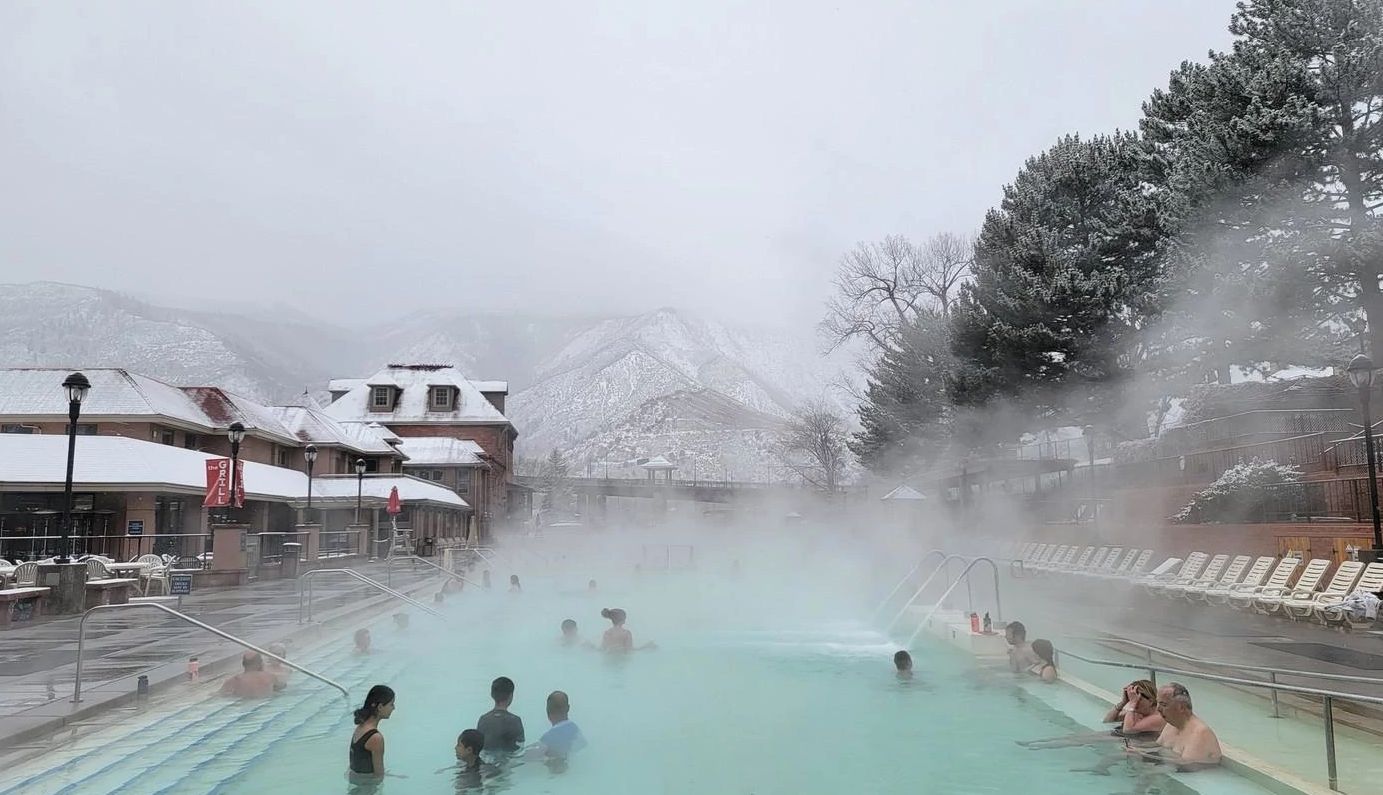 Glenwood Hot Springs Resort Bathers take a dip in Glenwood Springs pool in an icey-landscape