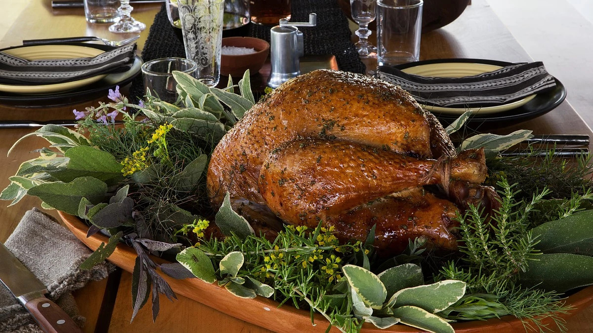 A close-up view of herb-roasted turkey with calvados gravy
