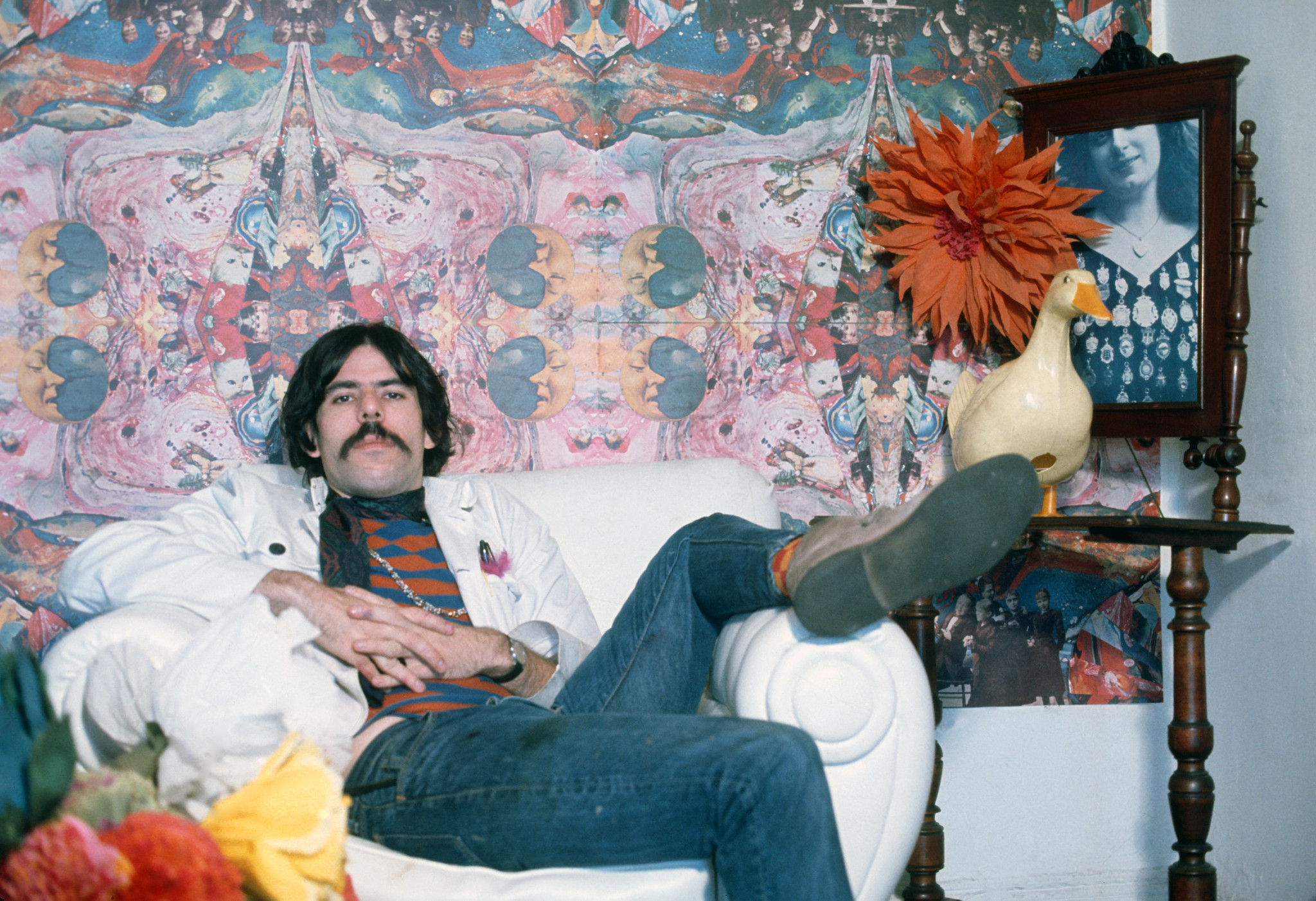 peter max relaxing in a chair as a young man in 1967