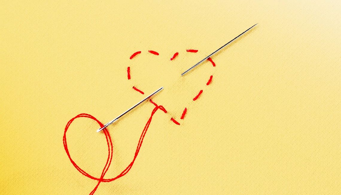 Smart Guide to Surgery stitches in a heart shape with needle on yellow background