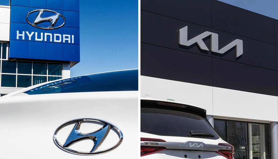 a hyundai car trunk showing the hyundai logo at a dealership and the same for kia