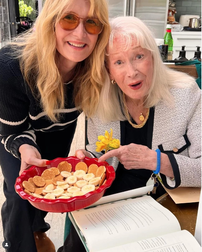 laura dern holding a bowl filled with banana pudding ingredients and standing beside her mother diane ladd