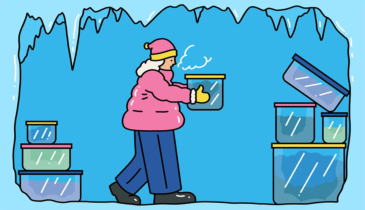 illustration of an older adult woman wearing a pink parka and winter hat inside a stylized freezer with icicles, carrying a storage container toward stacks of other clear frozen meal containers to represent the benefits of batch cooking and freezing leftovers