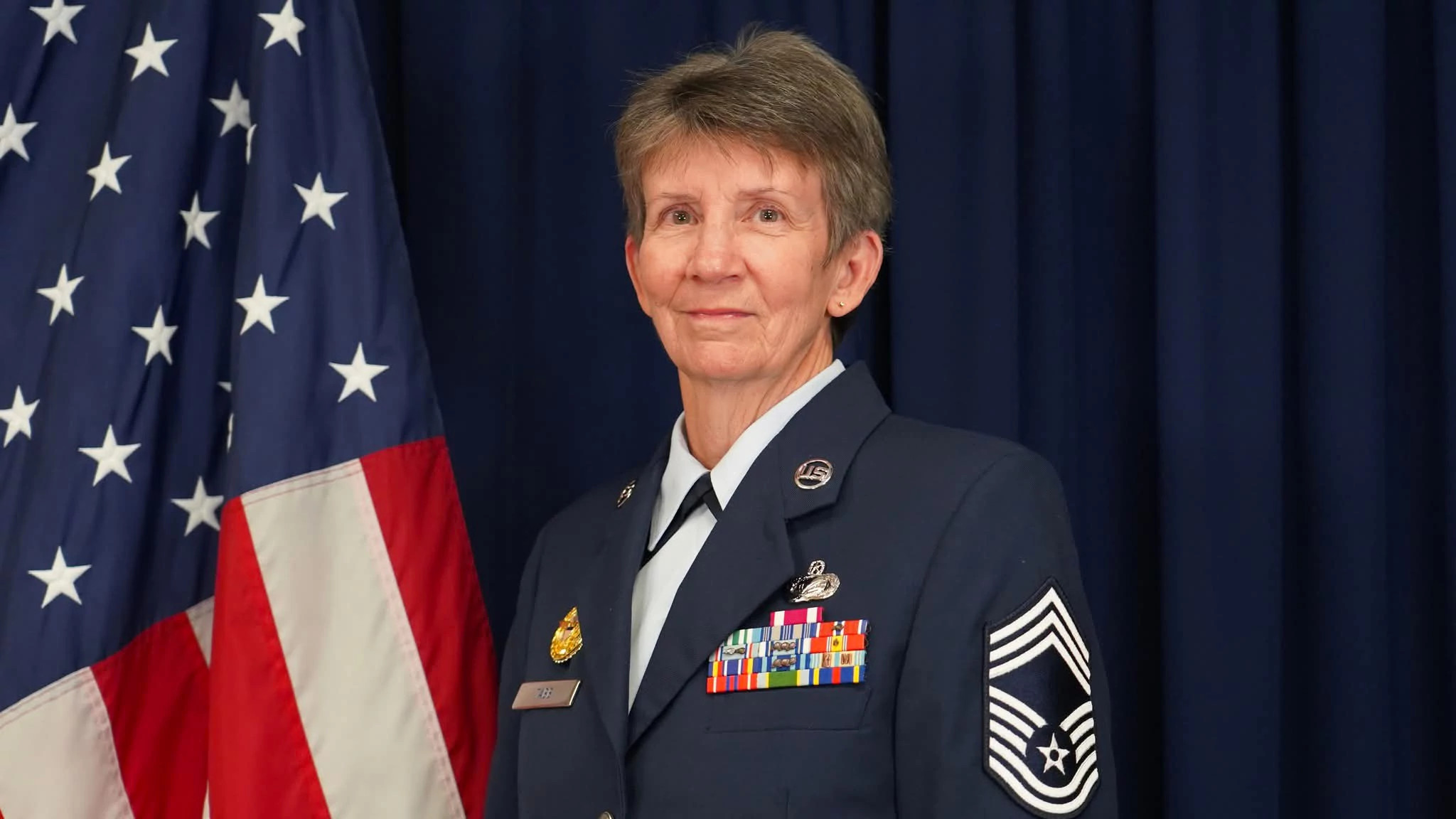 Jayne Tabb posing for a portrait in her Air Force dress uniform