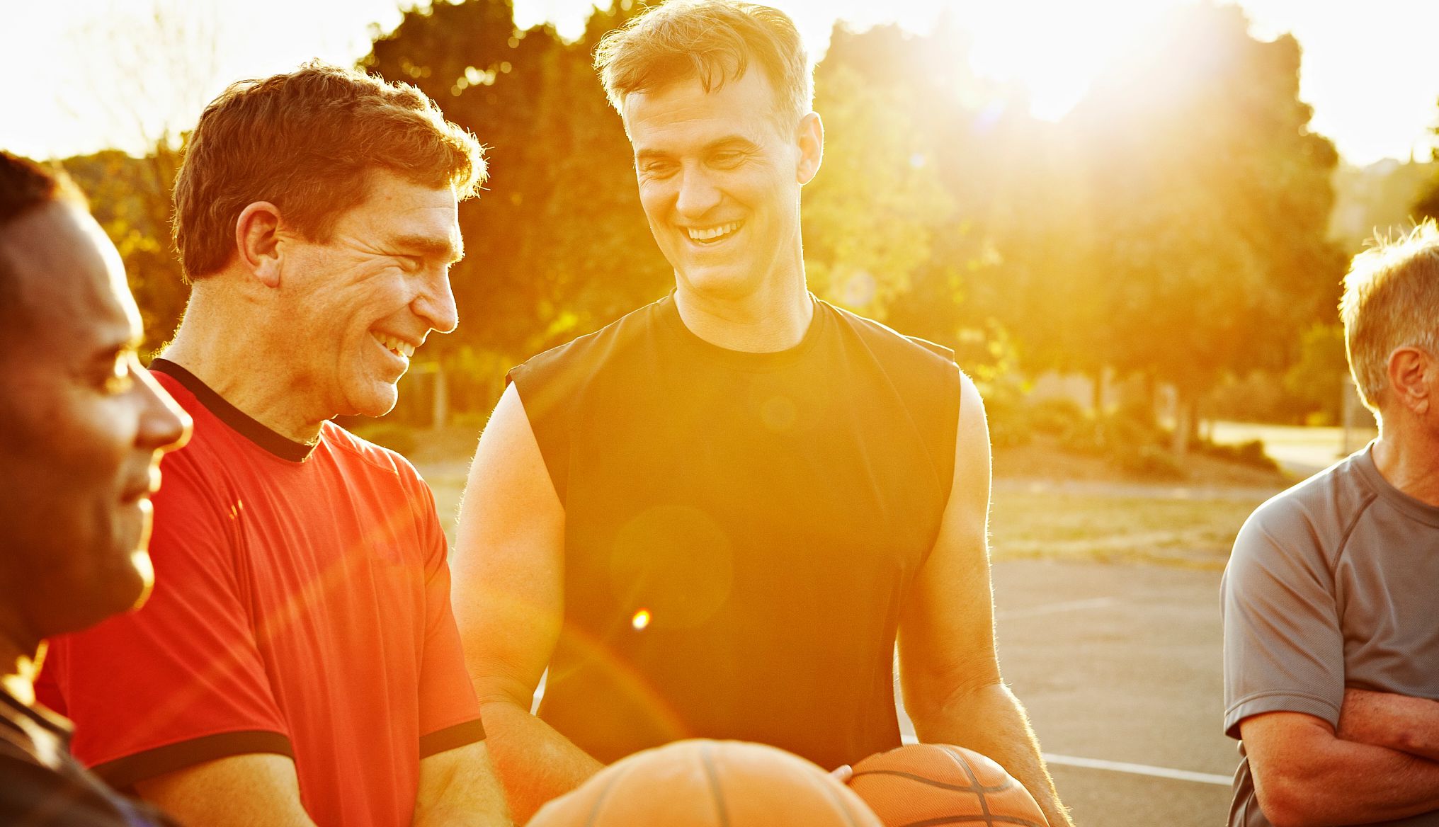 How men can make friends after 50 group of men playing basketball outside