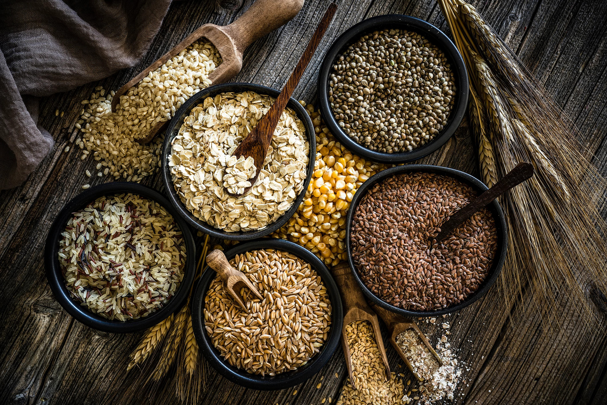 Large group of wholegrain food shot on rustic wooden table