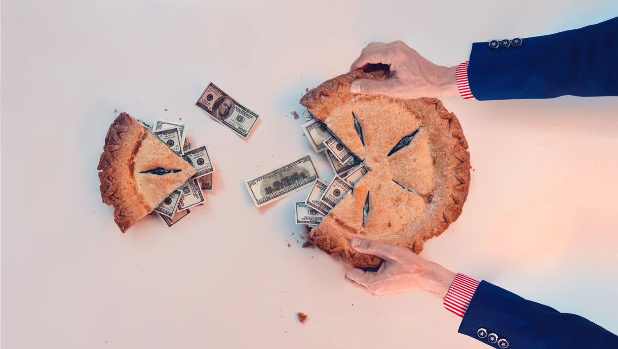 a piece is cut out of a pie, which is filled with hundred dollar bills.