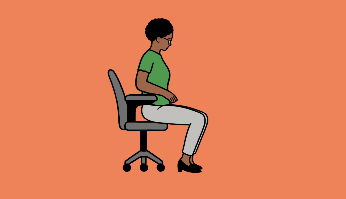 A woman sits in a chair, extending one leg in front.