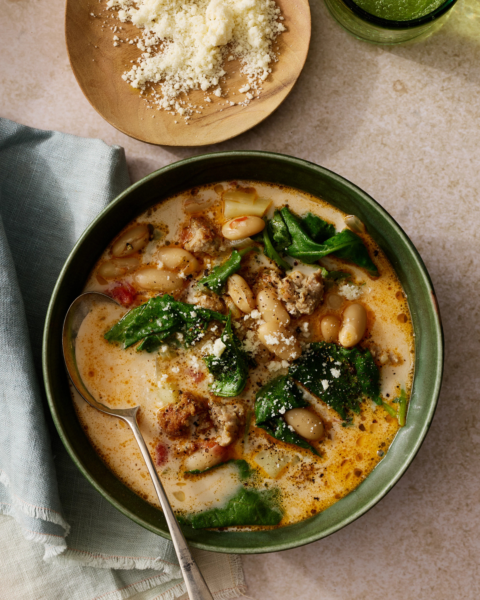 Tuscan White Bean, Sausage and Kale Soup is shown in a photo