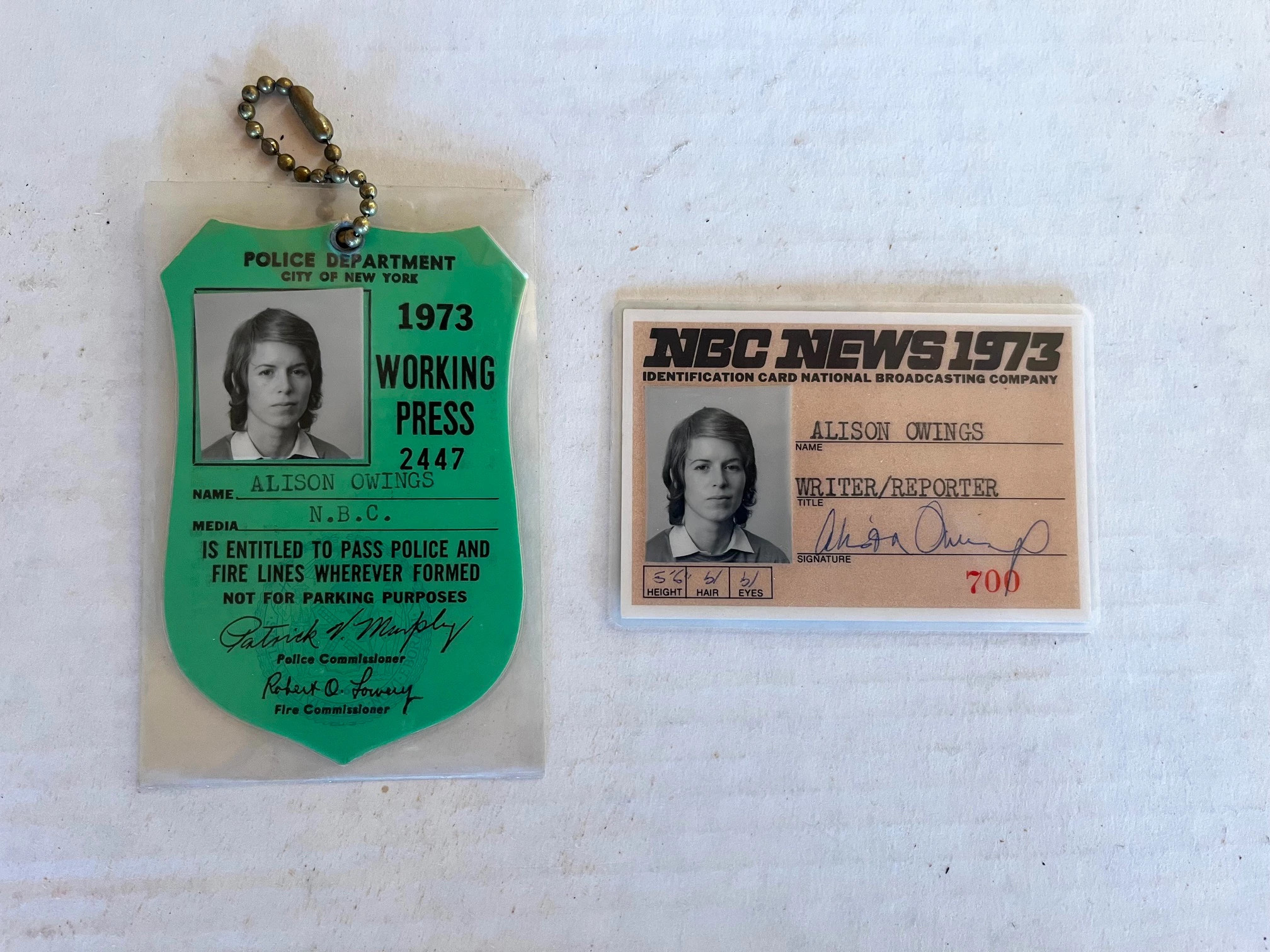 A New York City police working press badge and NBC news ID card belonging to Alison Owings.