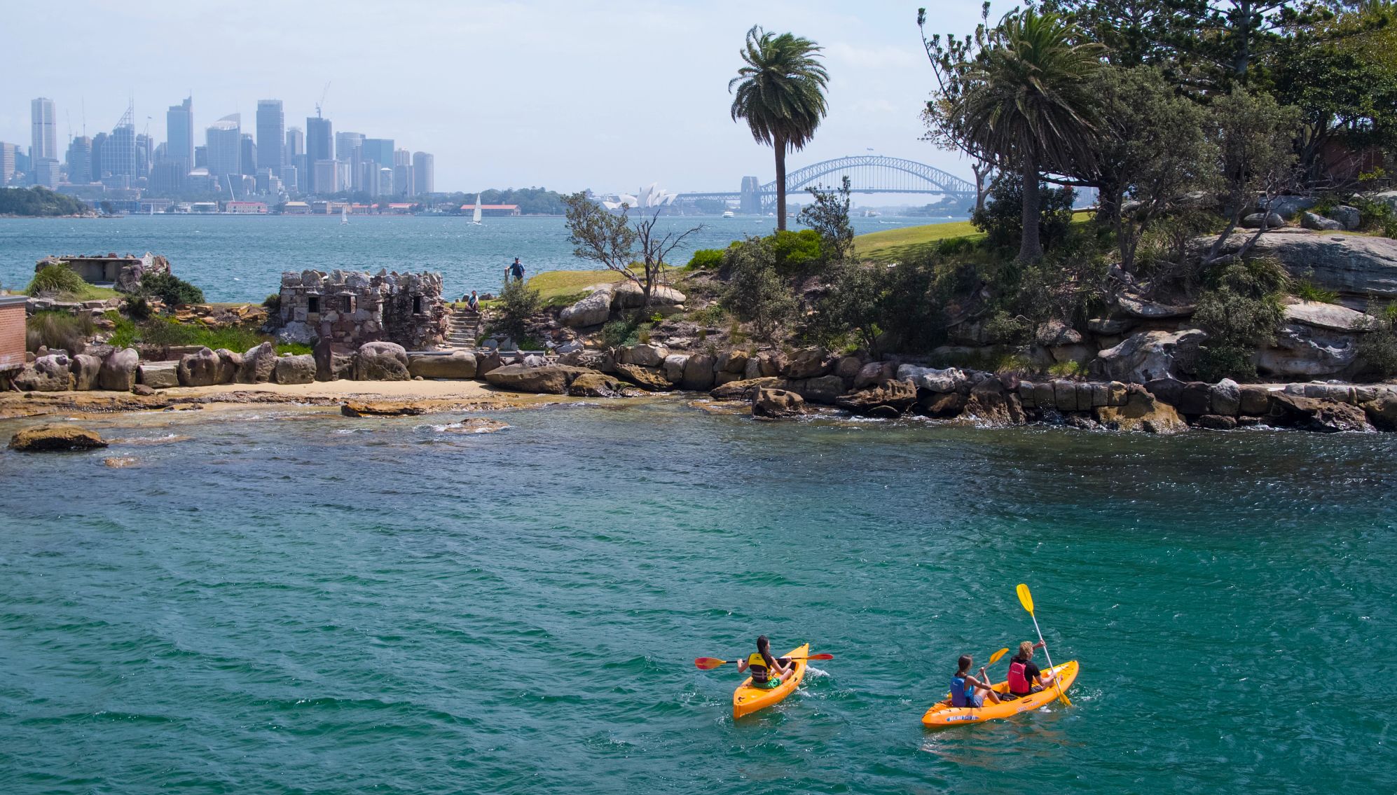 friends enjoying a day of kayaking on sydney harbour.
