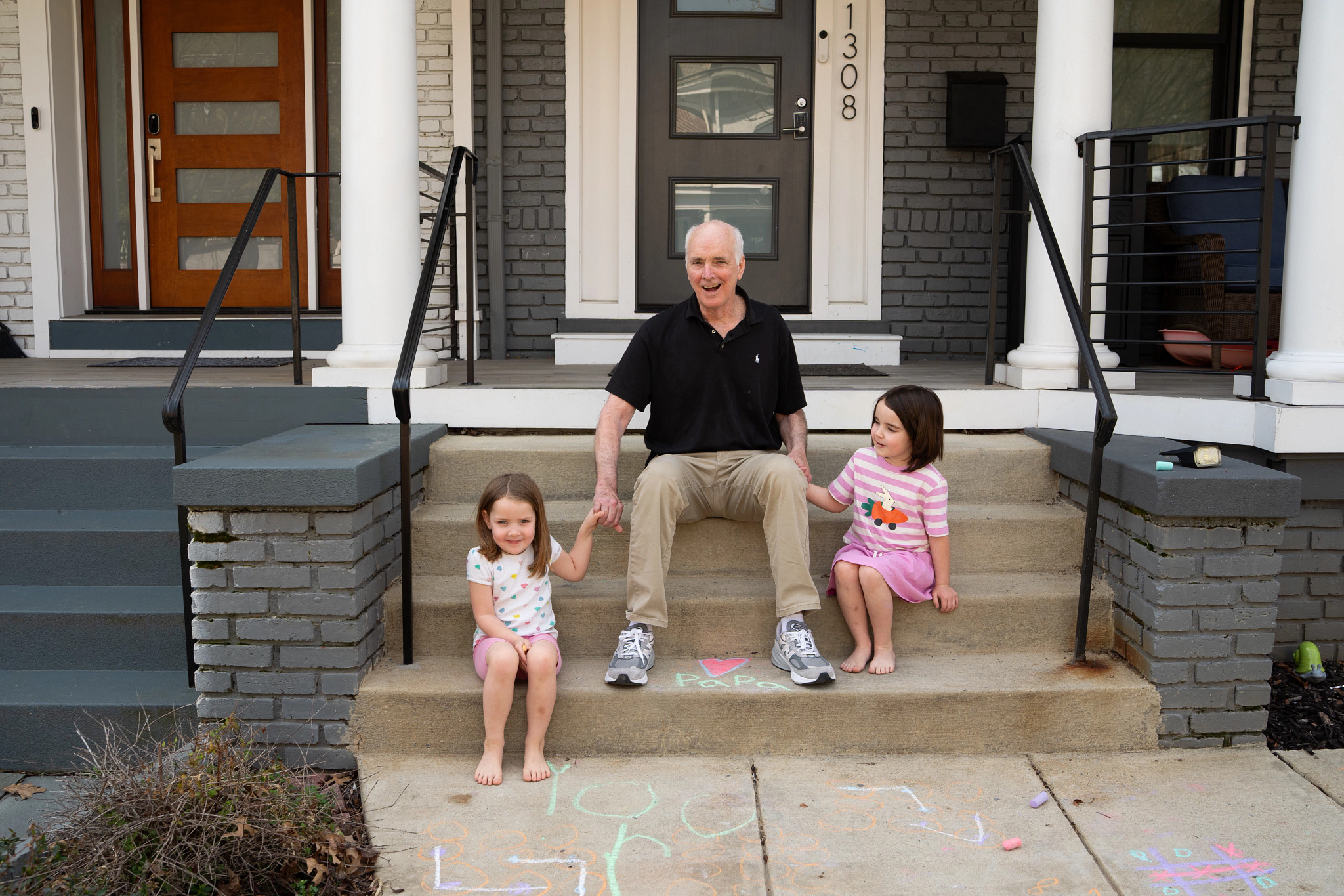 Collins plays with his granddaughters