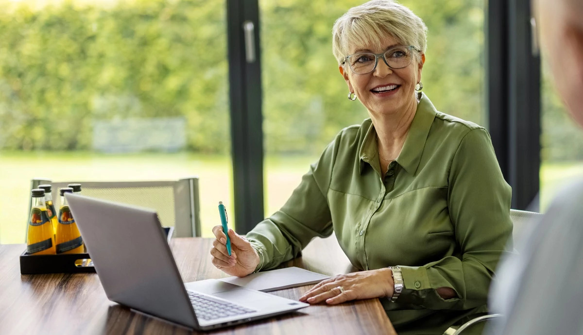 Woman smiling at desk
