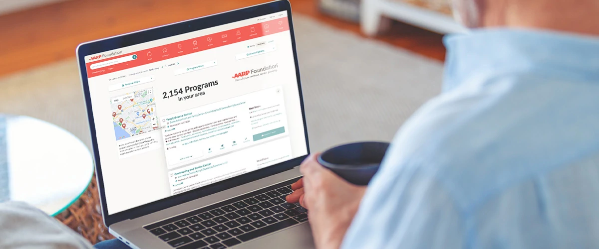 Open laptop with AARP website
